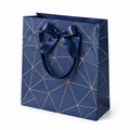 Busta regalo 32 x 12 x 26 cm in carta blu con fiocco e manici in nastro stile geometrico